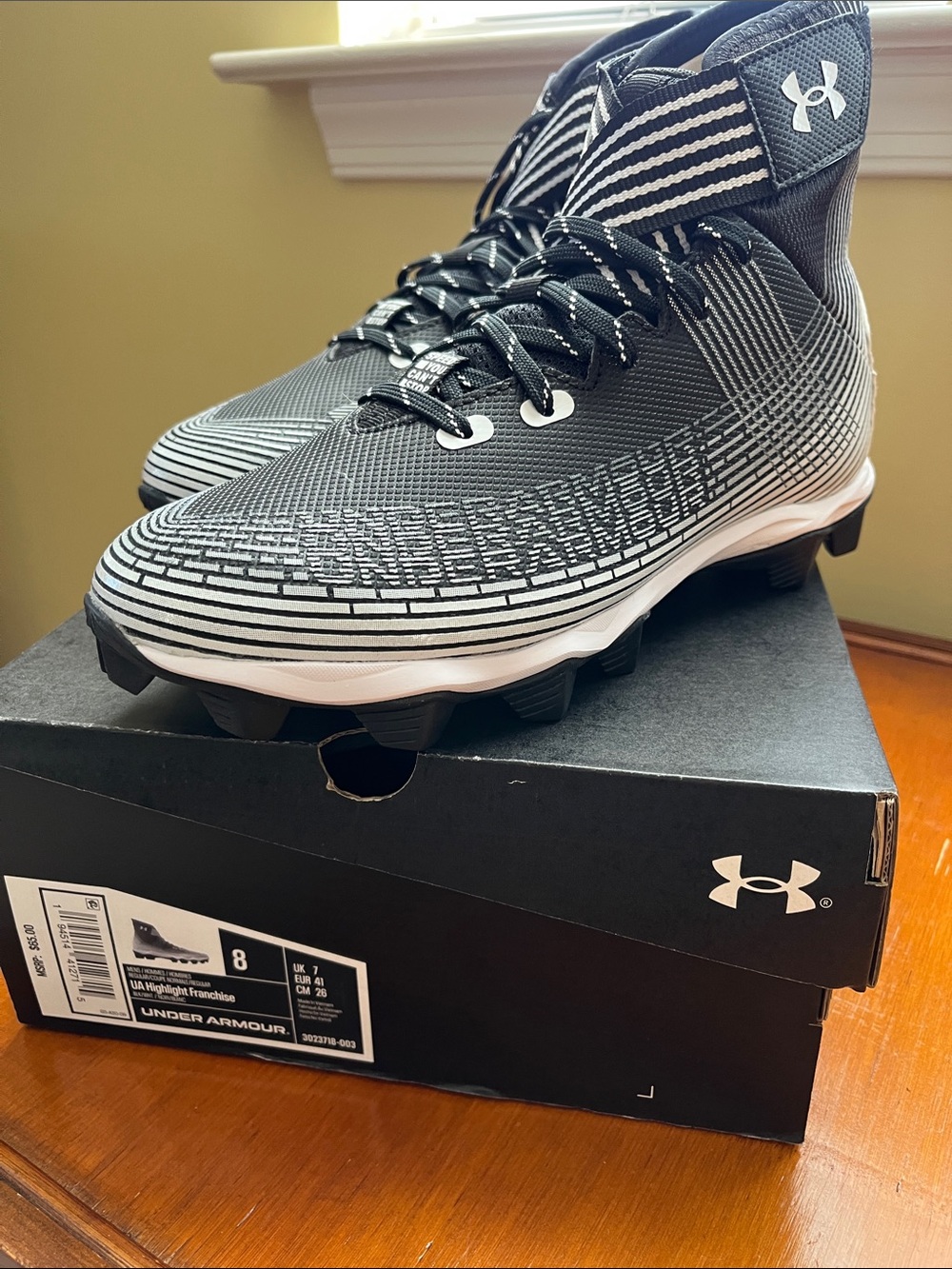 Under Armour Men’s Black and White High-Top Football Cleats